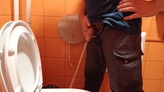 pee in a public orange toilet
