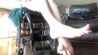 Pasty white numb legs of a paraplegic 