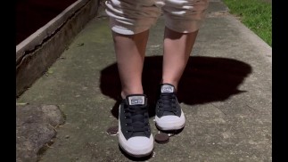 Crushing oreos in public with black converse chucks